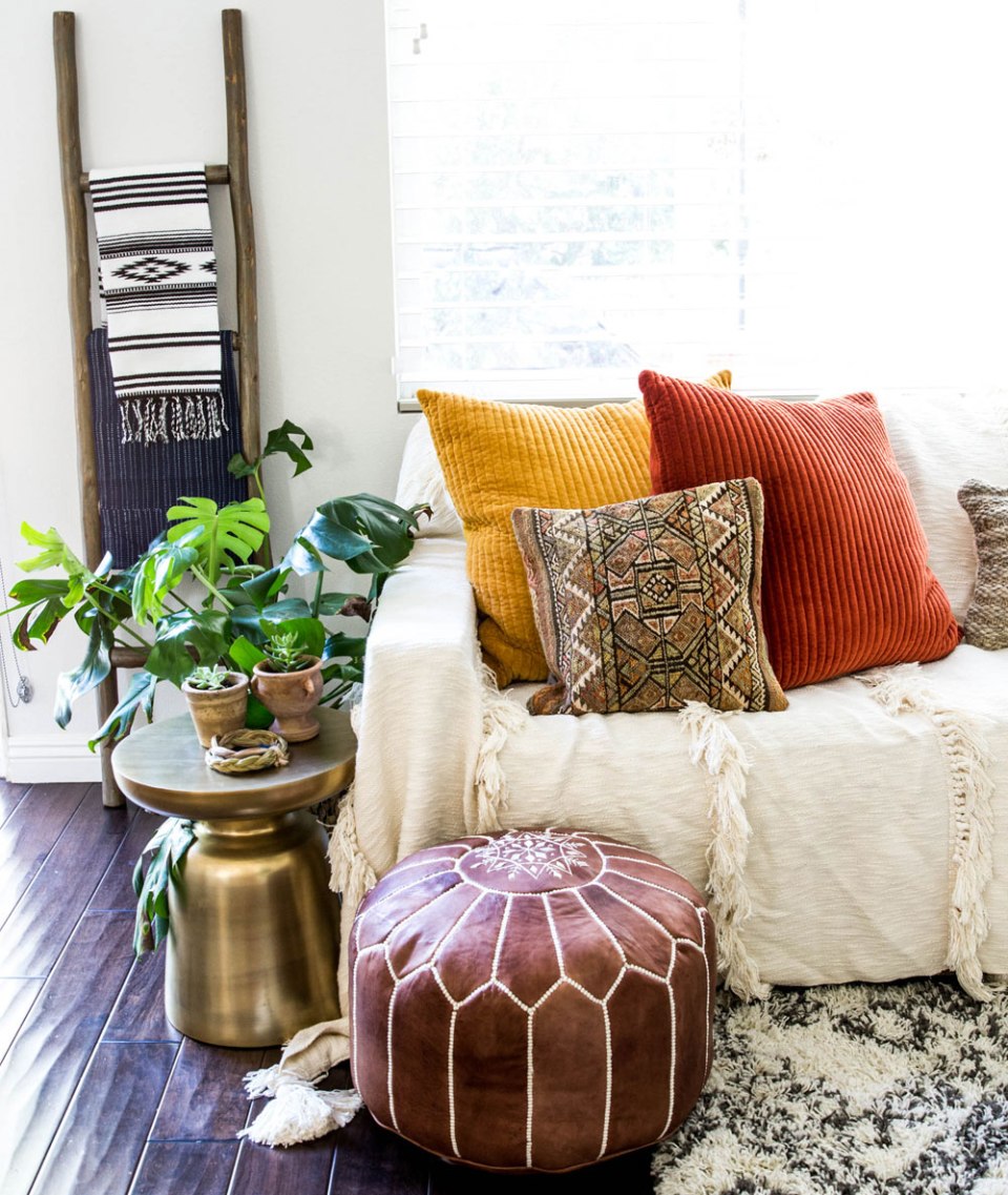 Boho sitting area space /Anita Yokota boho eclectic decor design inspo moroccan pouf throw blanket ladder kilim pillow west elm martini table