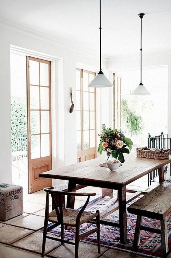 modern rustic French doors vintage rug dining table hanging pendants