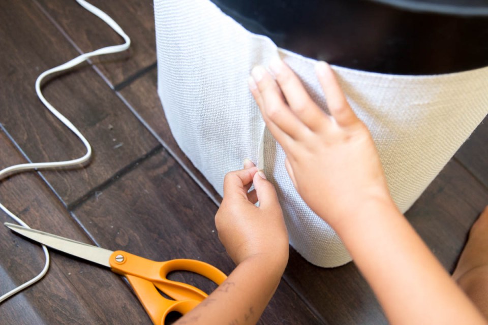 hot glue gun burlap on big black pot 