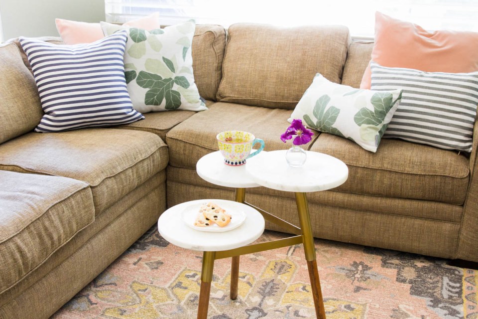 Stunning summer interior refresh - tiered coffee table and summer pillows from studio megee