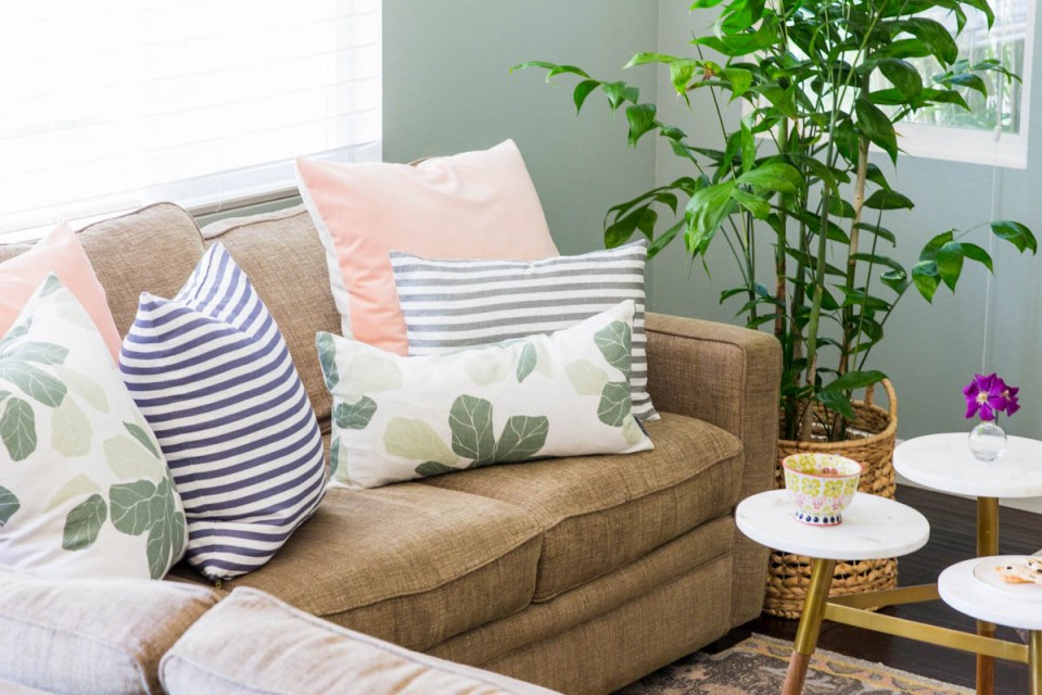 Stunning summer interior refresh - summer pillows from studio megee on neutral sofa