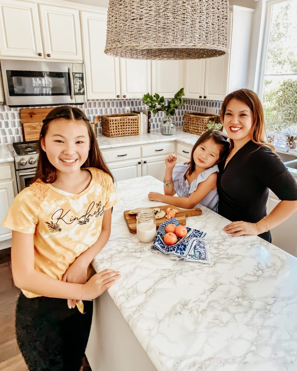 Natalie & Emily with Mom at the Kitchen Island