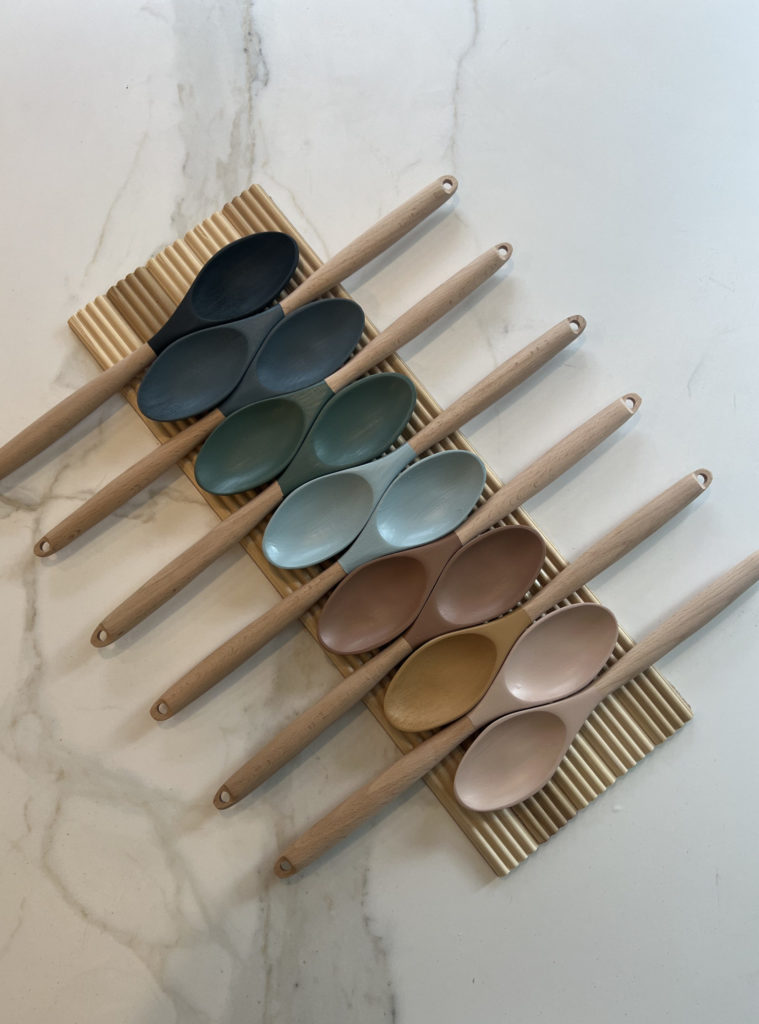 The painted spoons assembled on the counter