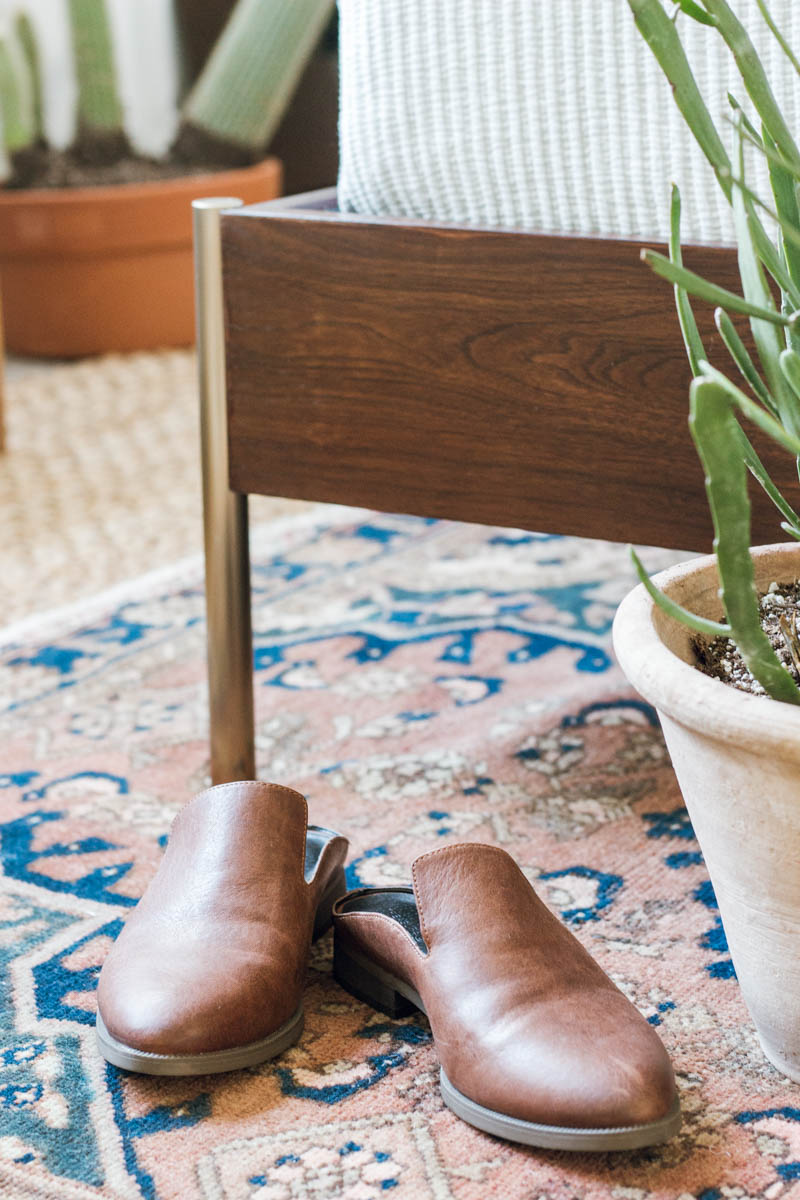 west elm bed mules shoes layered rugs euphorbia plant 