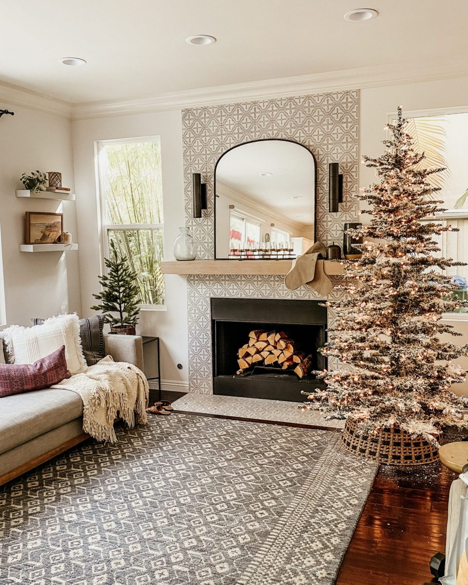 The tree is up in the family room, and cedar logs are in the fireplace