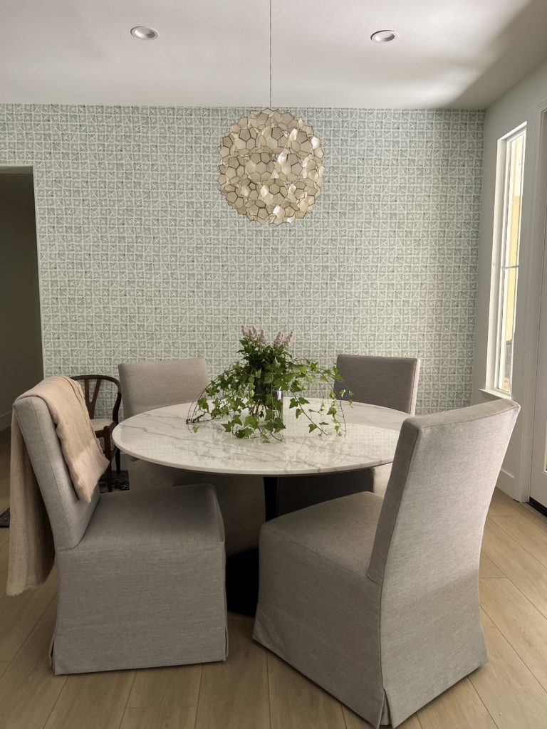 The wallpaper gives the room a natural focal point