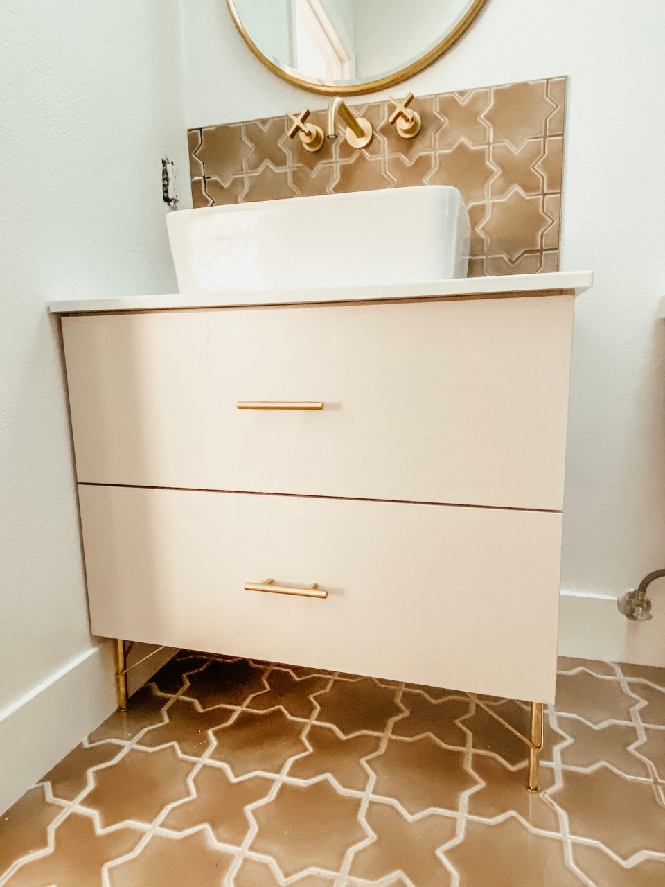 A close up of the in-progress vanity, with vessel sink settled on top, but not yet installed