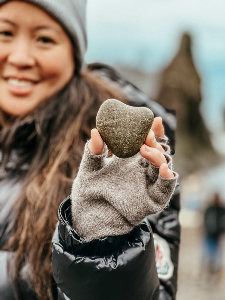 My sister, holding a heart-shaped rock she found, a thoughtful little gift!