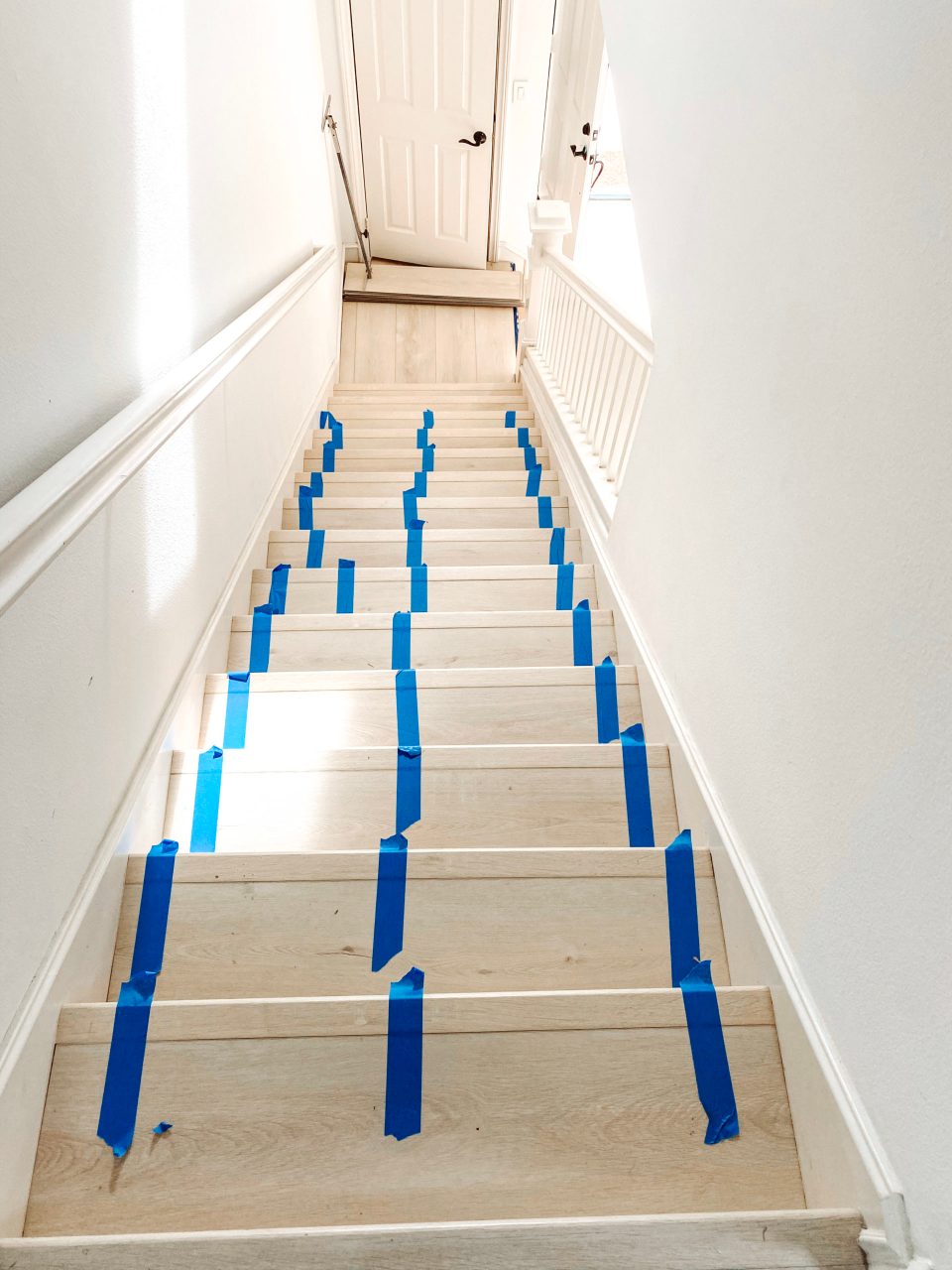 The bright new floors still with painters tape