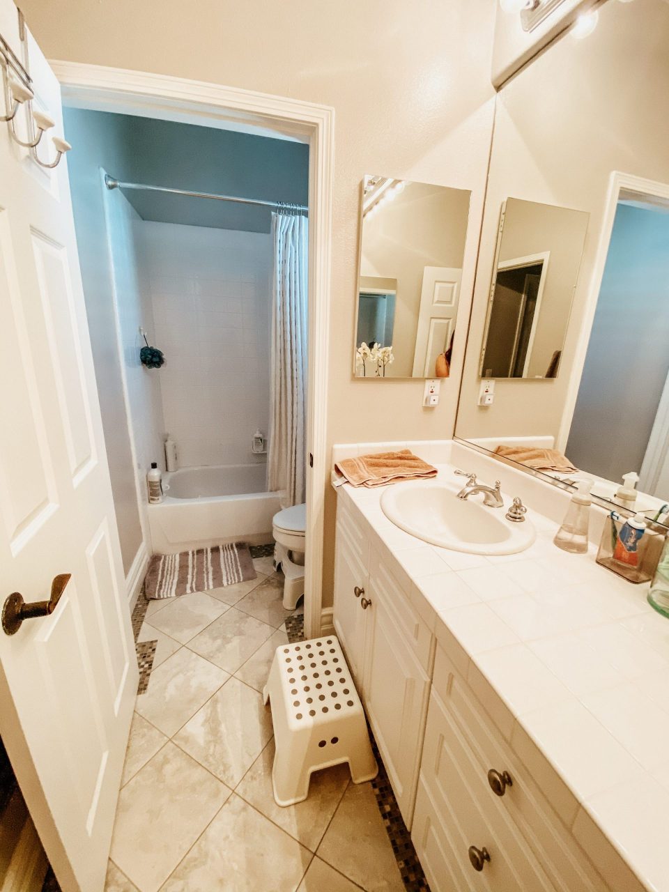 The Desert Den's pre-demo bathroom, single sink with step stool, separate water closet 