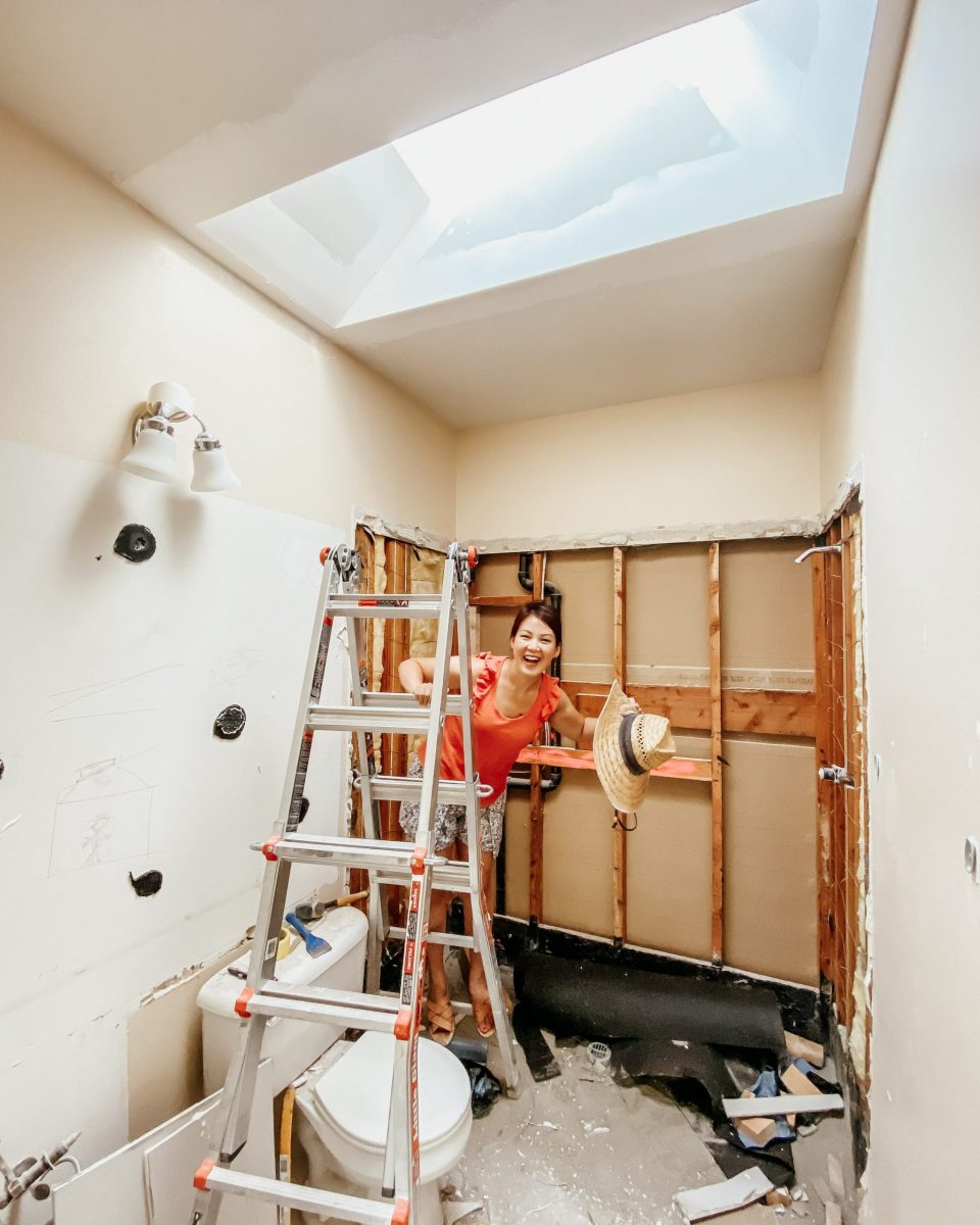 Anita in the demo'd bathroom, under the new skylight! 