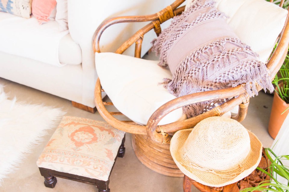 rattan boho chic chair with fringe pillow foot stool