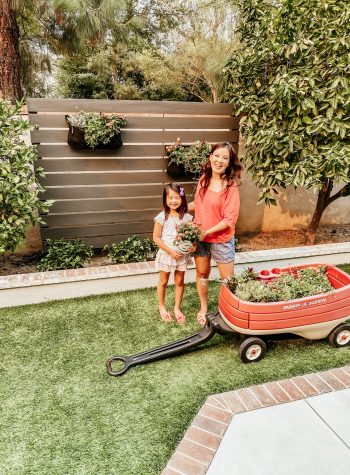 Anita & Natalie with the last of the Little Tikes toys: a red wagon