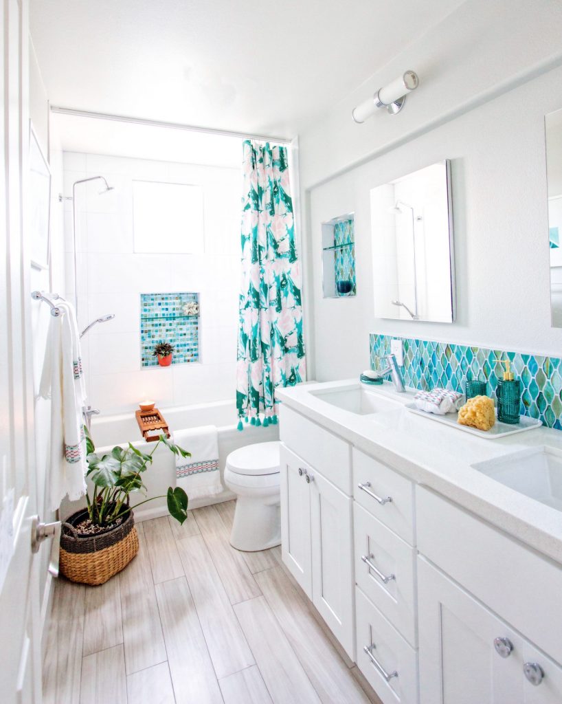 white bathroom blue and green glass tile Drew Barrymore flower line Walmart