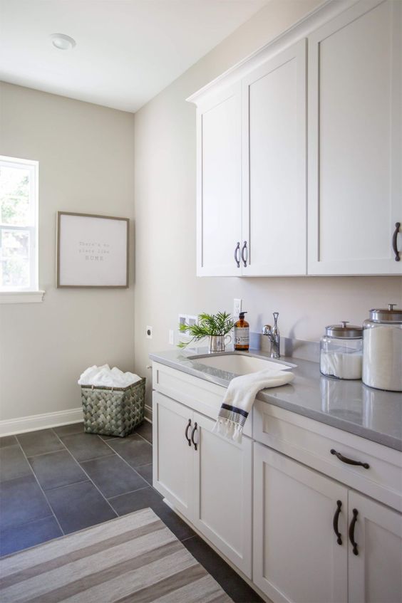 Laundry room in Worldly Gray by Cottage Home Company (Shuman Mabe Interiors, LLC)