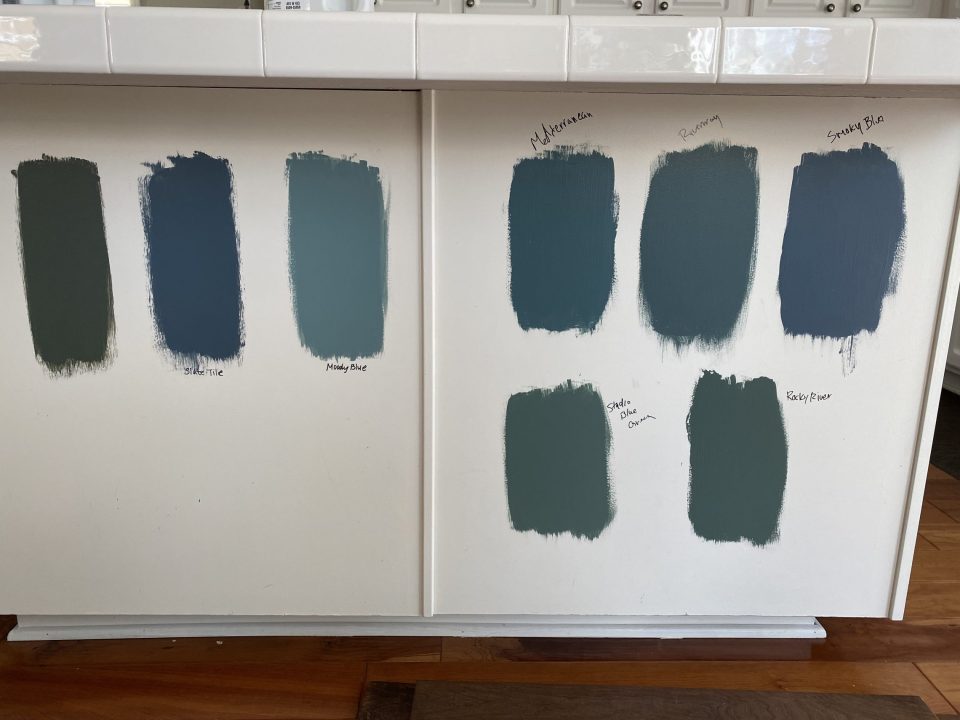 Some of the blue swatches we painted onto the island to decide between