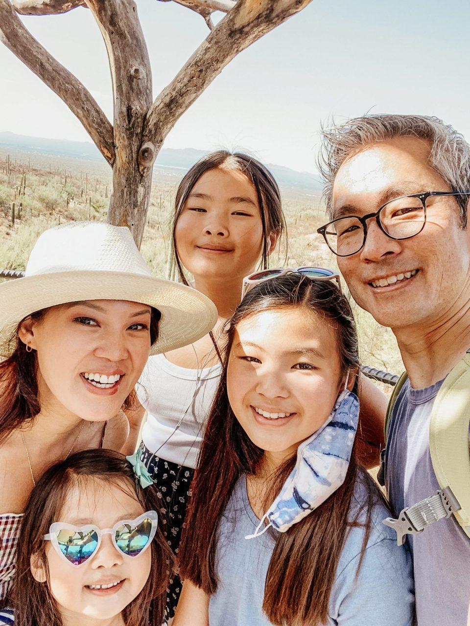 the whole Yokota family smiles in the desert shade! 
