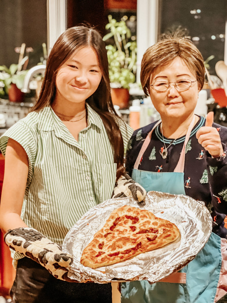 Emily and her grandmother make bread together, an Act of Service for the family
