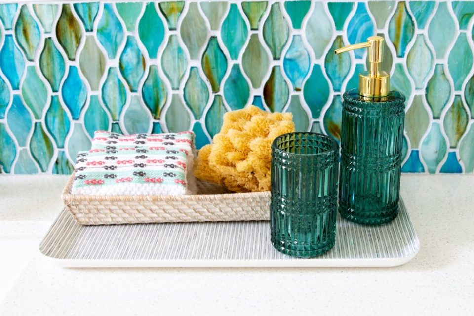 white bathroom blue and green glass tile Drew Barrymore flower line Walmart