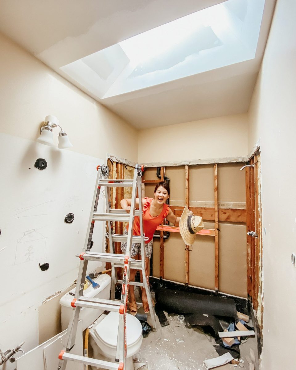 Anita in the demo'd bathroom, under the new skylight!