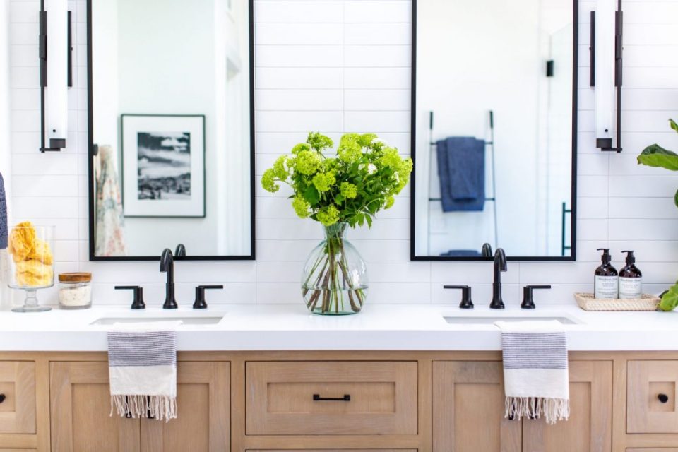 Bright white bathroom white oak cabinets brass fixtures