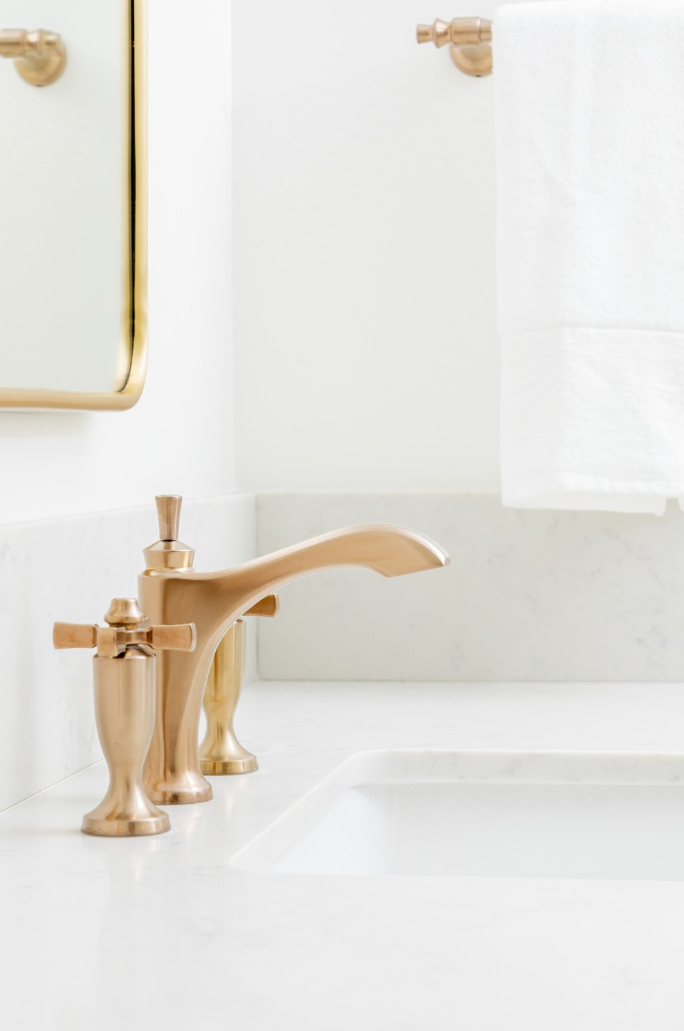Delta's Dorval faucet with cross handles and a brass finish