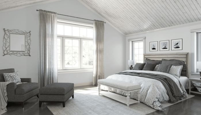 Sherwin Williams Reflection 7661 is a cool gray paint color with a slight blue undertone in this bedroom.